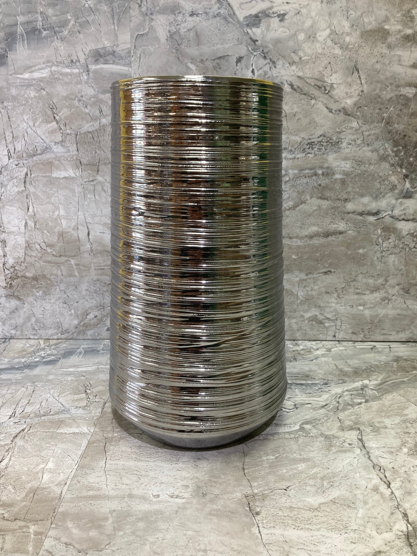 Flower vase Silver color .Made of ceramic elegant and classy home decor.