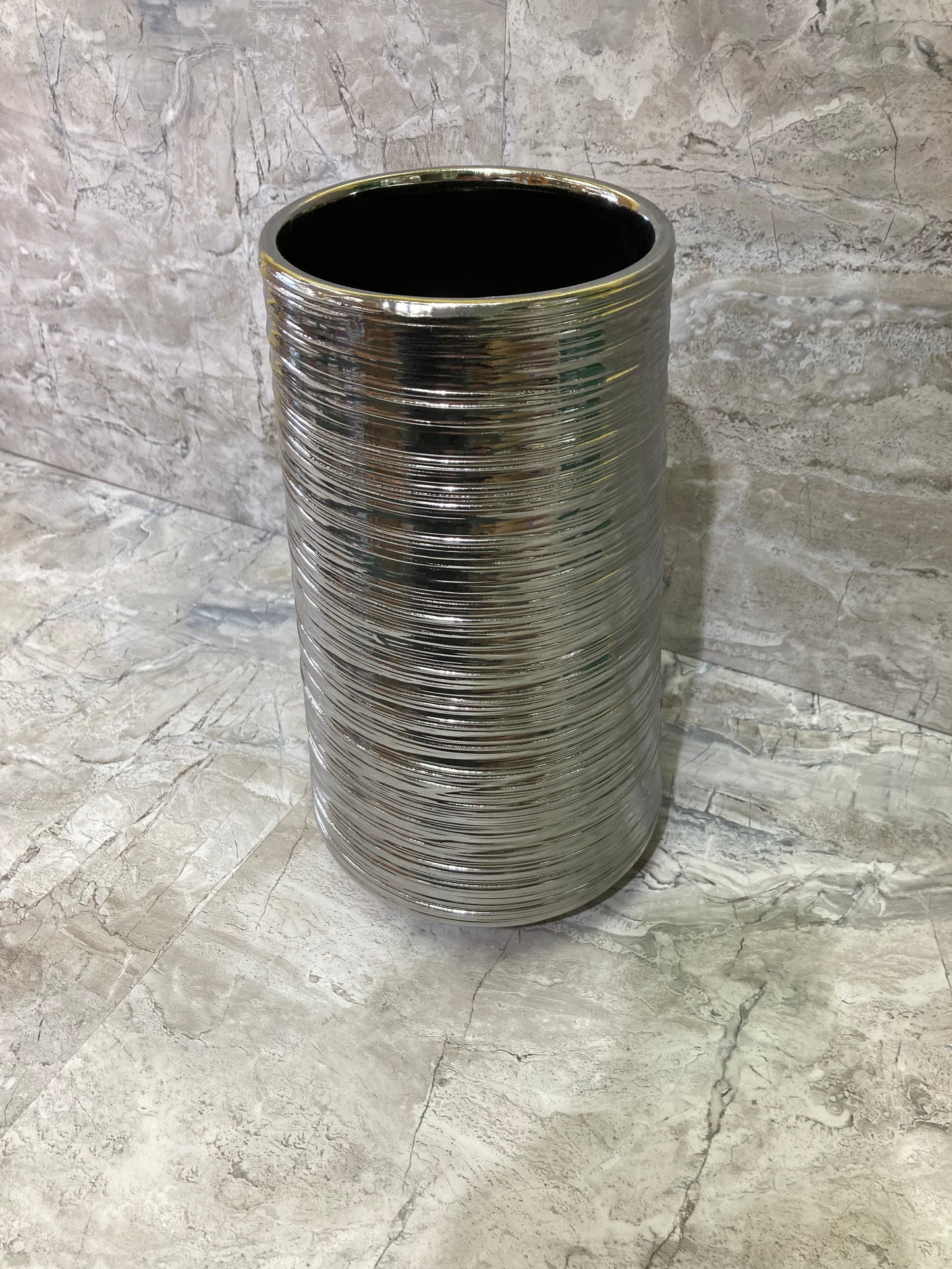 Flower vase Silver color .Made of ceramic elegant and classy home decor.