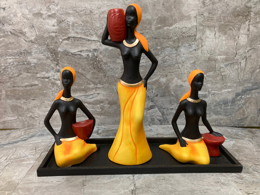 Figurine 3 pcs beautiful African ladies statute ,with a black wooden base . Stylish home decor ,vibrant colors .