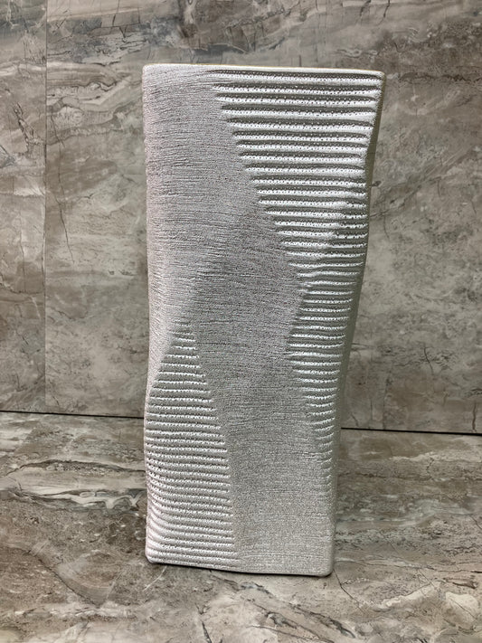 Flower vase silver color square shape.Made of ceramic elegant and classy home decor.