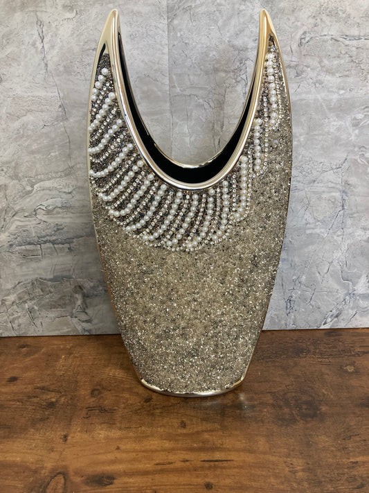 Flower vase gold color with pearls and stones decoration .Made of ceramic unique home decor.